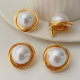 Big gold twist earrings