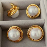 Big gold twist earrings