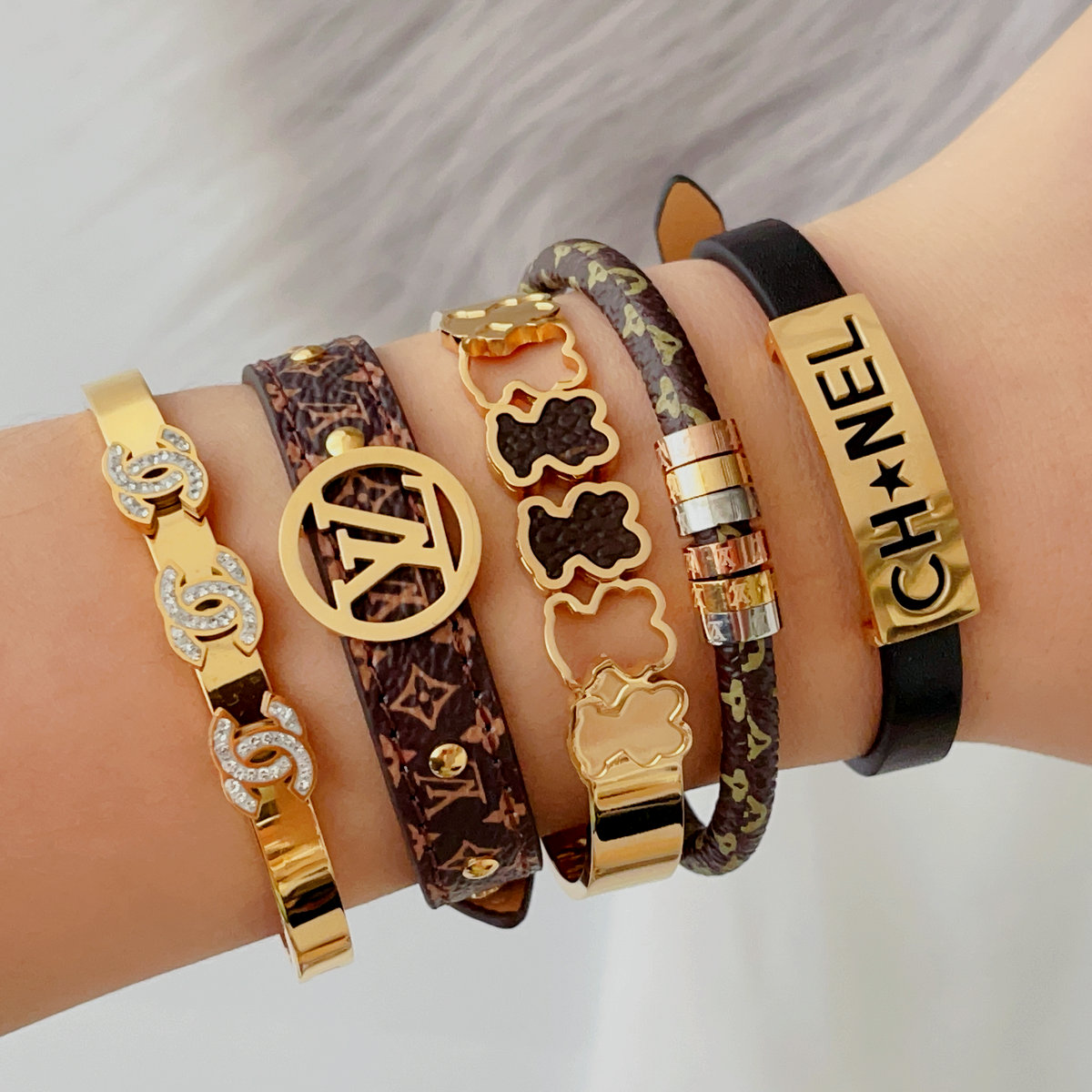 Stainless steel channel leather bangle