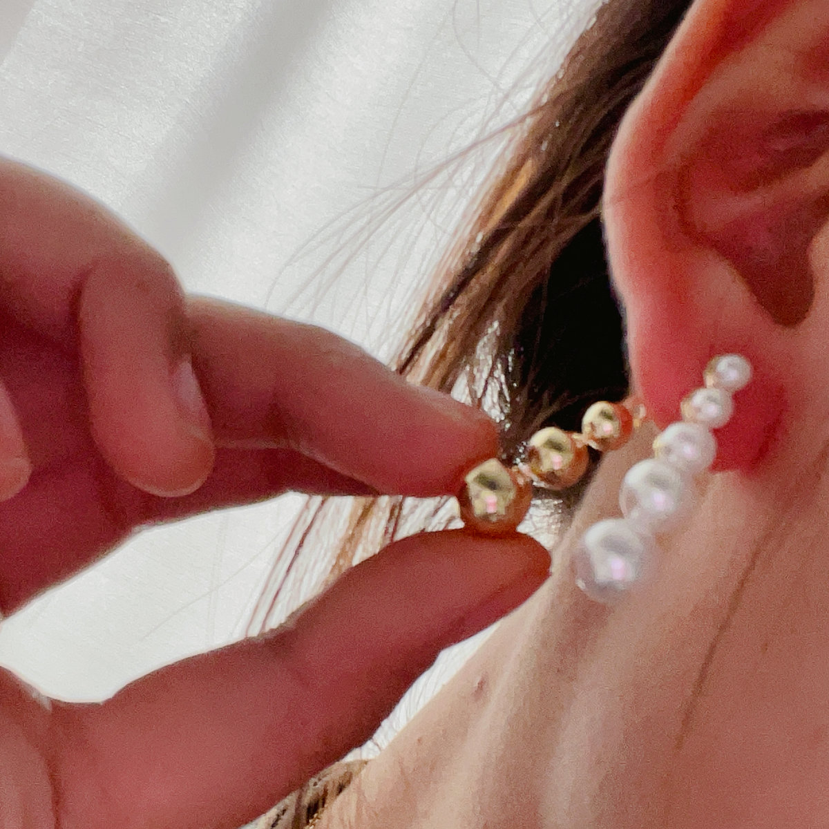 Half pearl and gold ball earrings