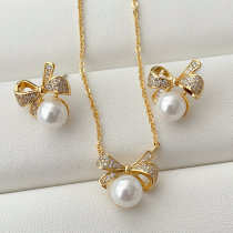Bow pearl set earrings and necklace