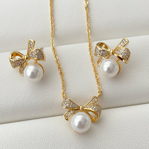 Bow pearl set earrings and necklace