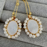 Pearl oval shell cross pendant necklace