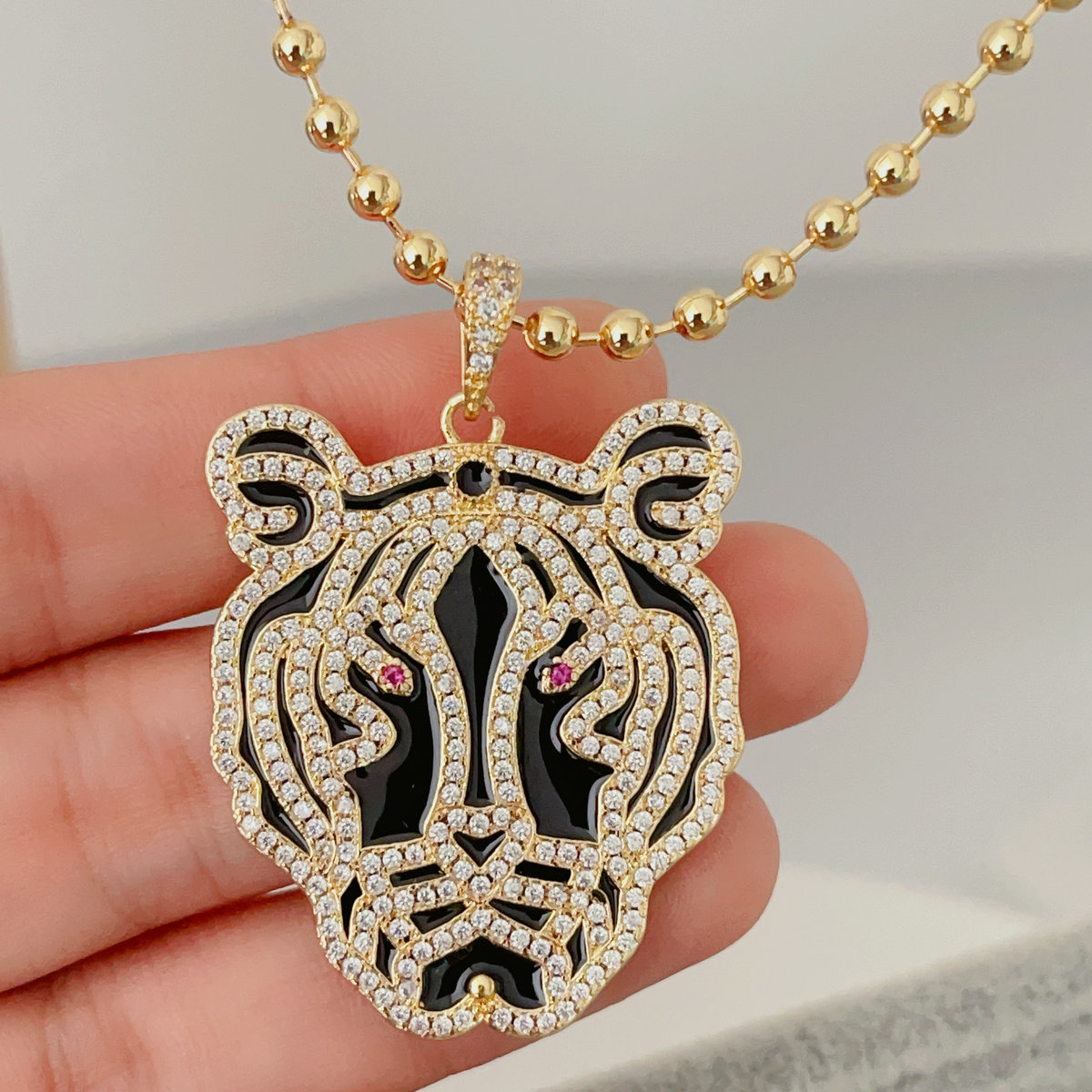 Black enamel tiger pendant beaded necklace