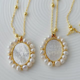 Pearl oval shell cross pendant necklace