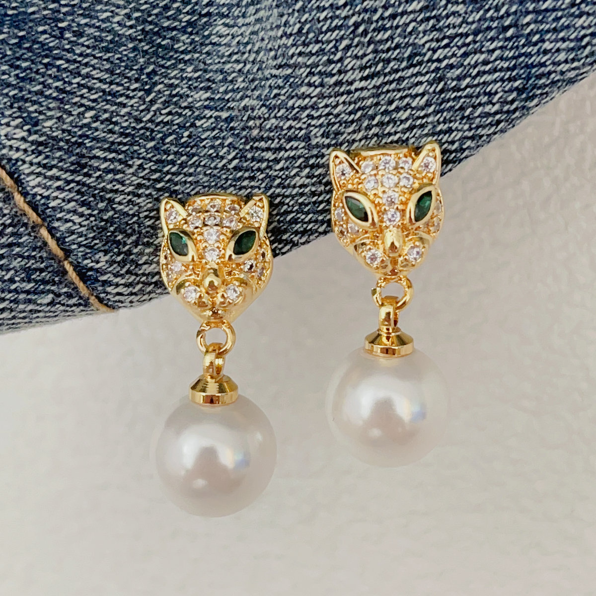 Pave tiger peal drop earrings