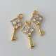 Pave key charm