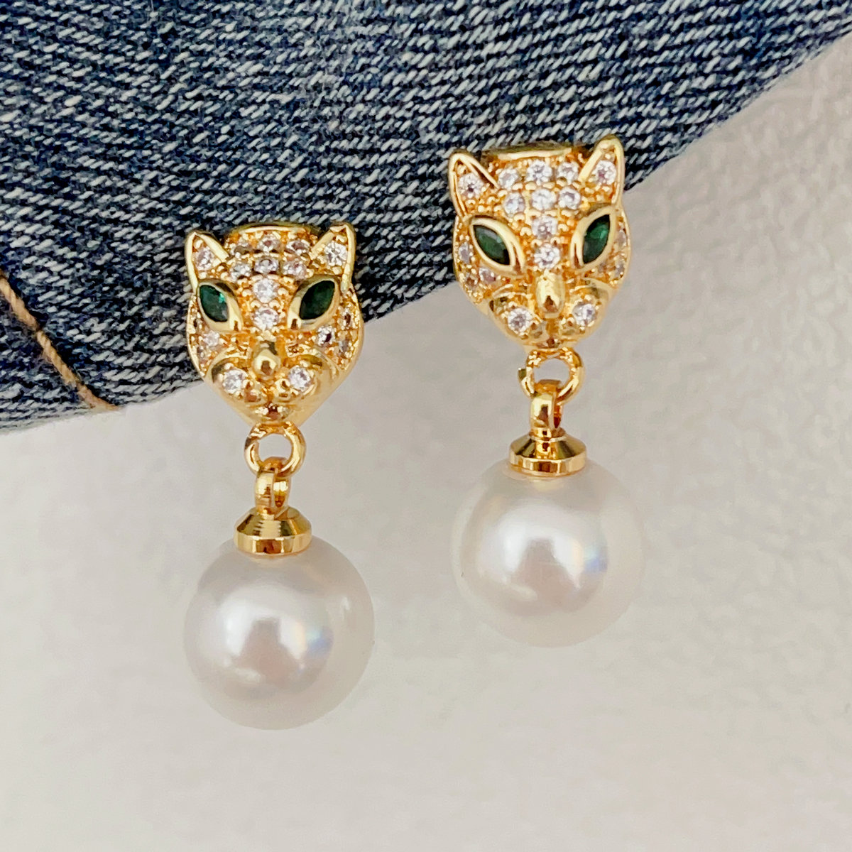 Pave tiger peal drop earrings