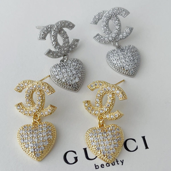 Pave heart charm channel earrings