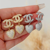 Pave heart charm channel earrings
