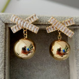 Cross gold ball drop earrings