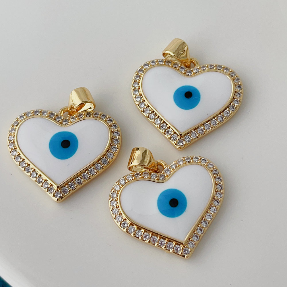 White enamel eye heart charm