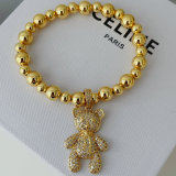 Teddy bear charm gold ball bracelet
