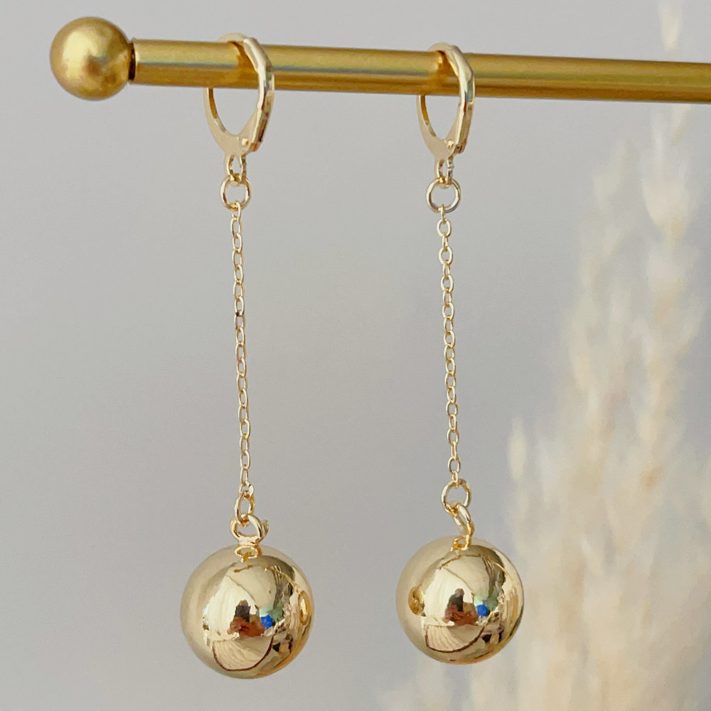 Long gold ball earrings