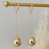 Long gold ball earrings