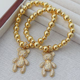 Teddy bear charm gold ball bracelet