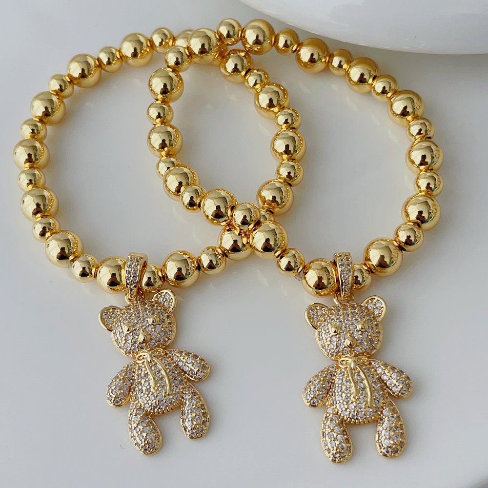Teddy bear charm gold ball bracelet