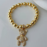 Teddy bear charm gold ball bracelet