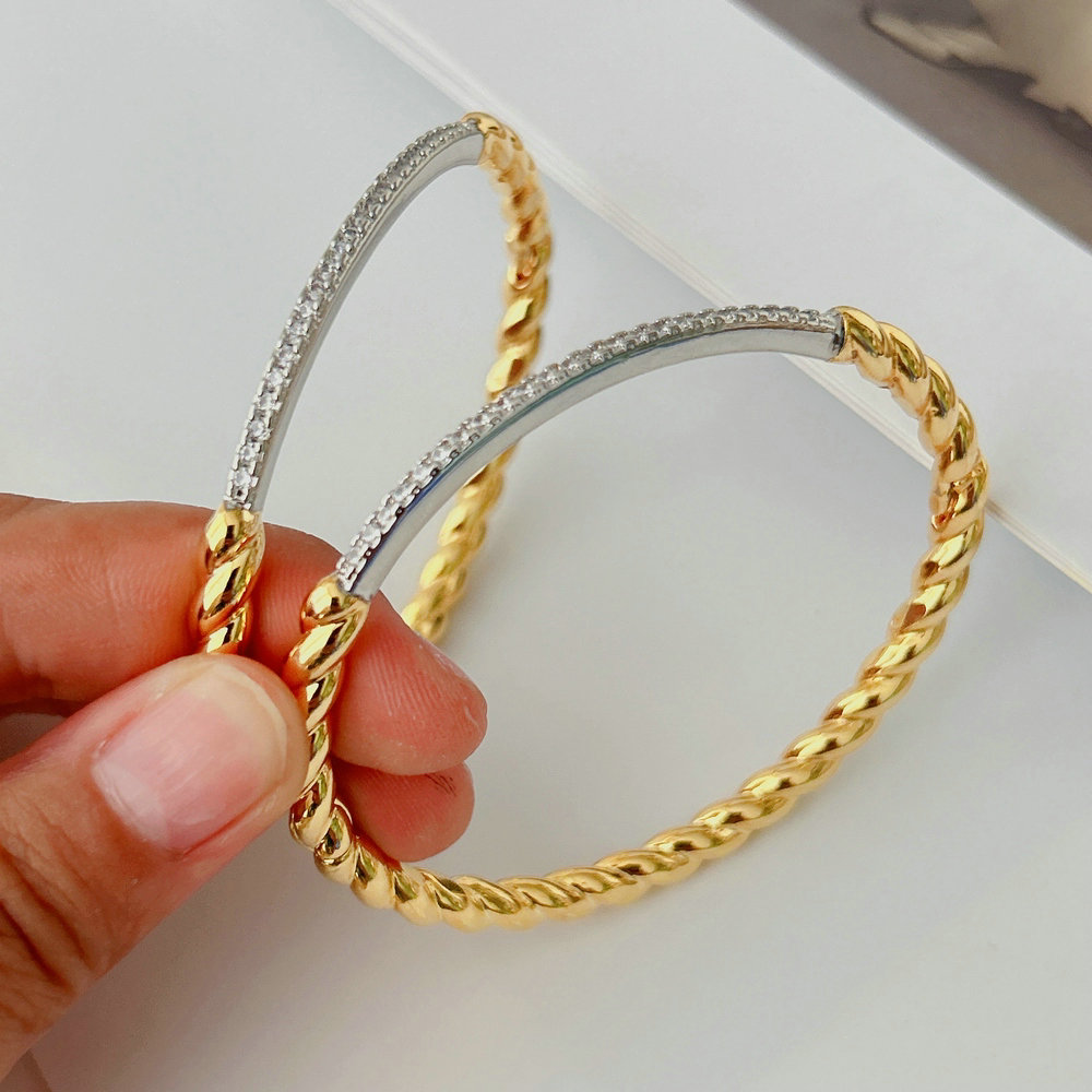 Silver and gold color twist bangle