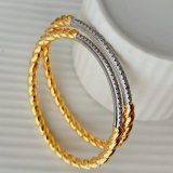 Silver and gold color twist bangle