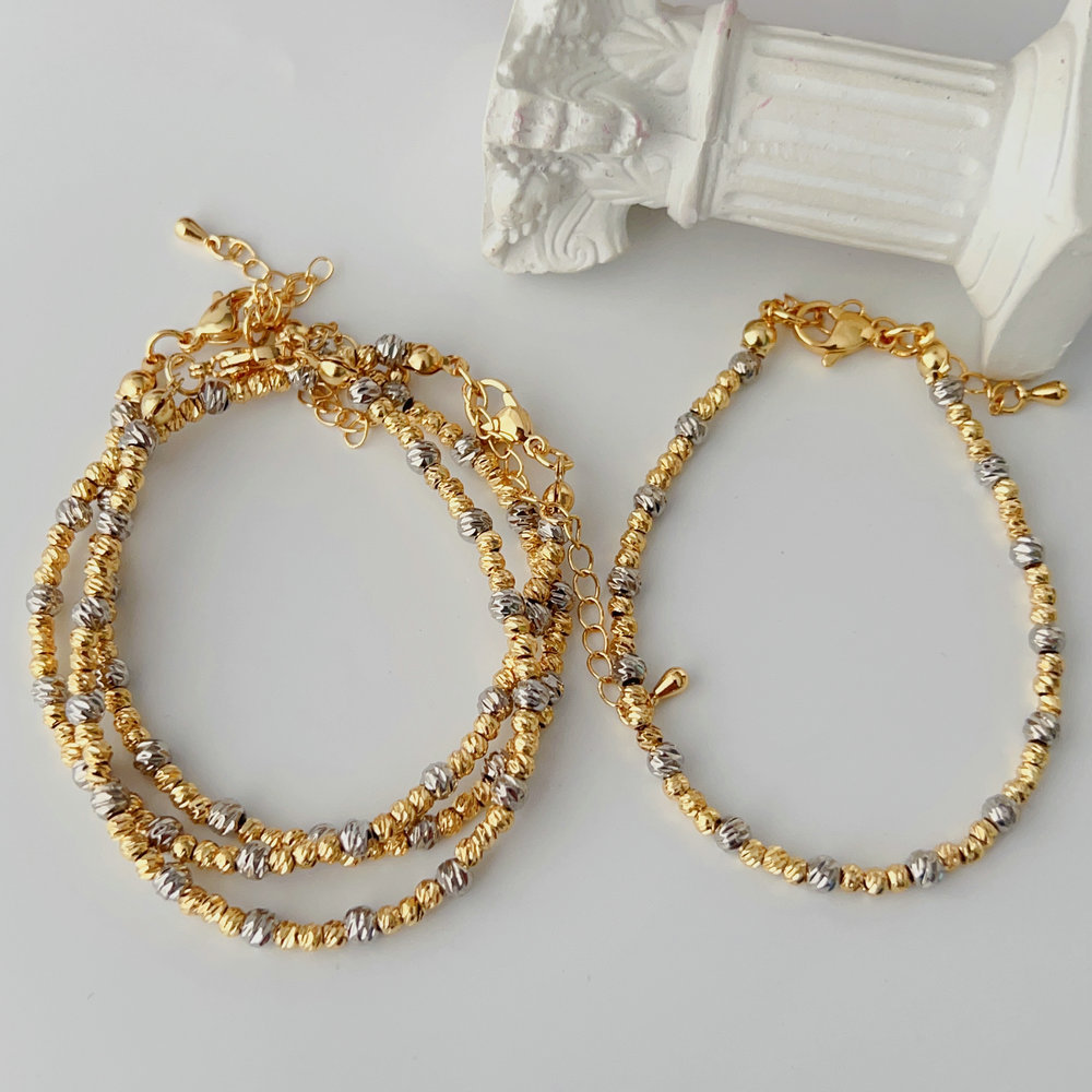Silver and gold bead bracelet
