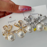 Butterfly bow pearl earrings