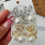 Butterfly bow pearl earrings