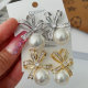 Butterfly bow pearl earrings