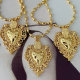 Oval gold bead necklace with heart charm