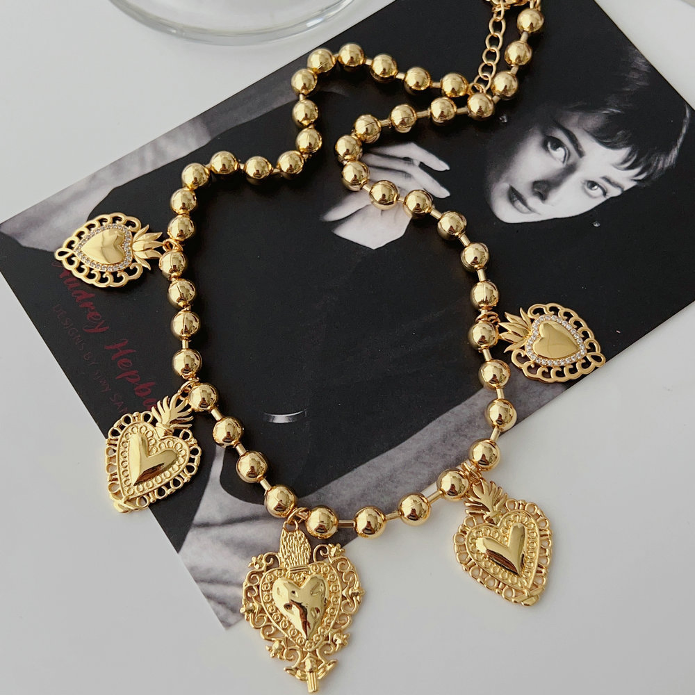 Gold bead chain necklace with heart charm