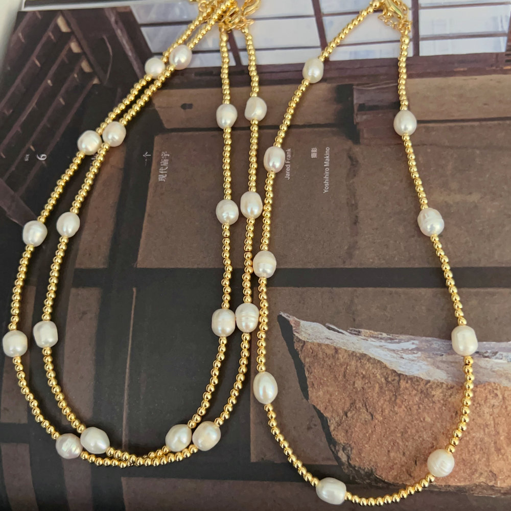 Gold bead necklace with fresh water pearl