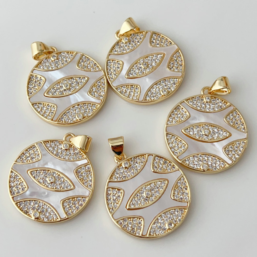 Shell round eye charm