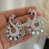Pave clear peacock earrings