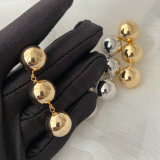 Gold ball long earrings