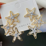 Pave crystal star earrings