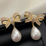 Pave bow pearl earrings