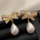 Pave bow pearl earrings