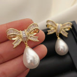 Pave bow pearl earrings