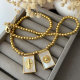 Gold bead with square charm necklace