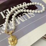 Shell pearl necklace with charm