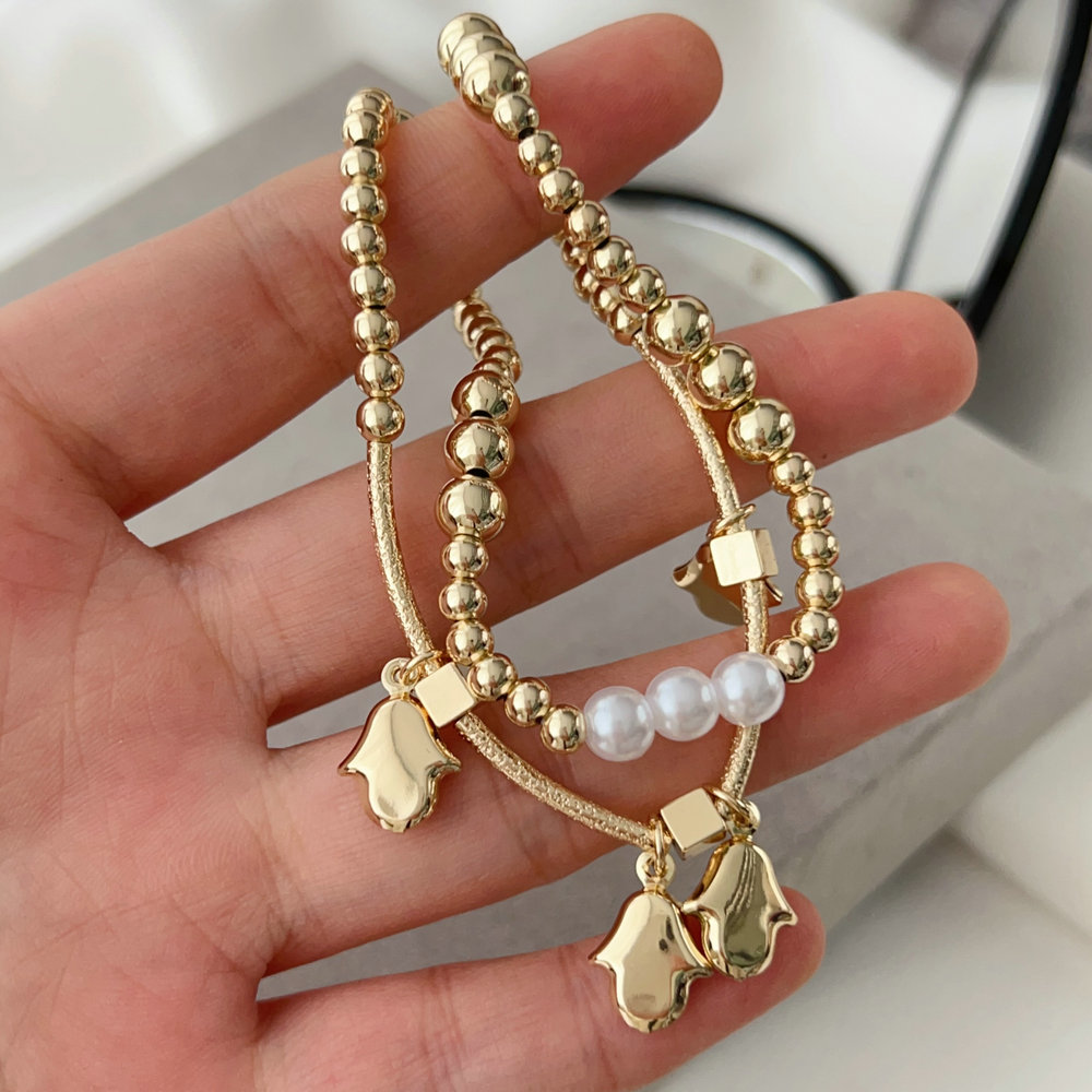 Brass bead bracelet with hand charm