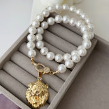 Shell pearl necklace with charm