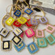 Gold bead with square handmade charm
