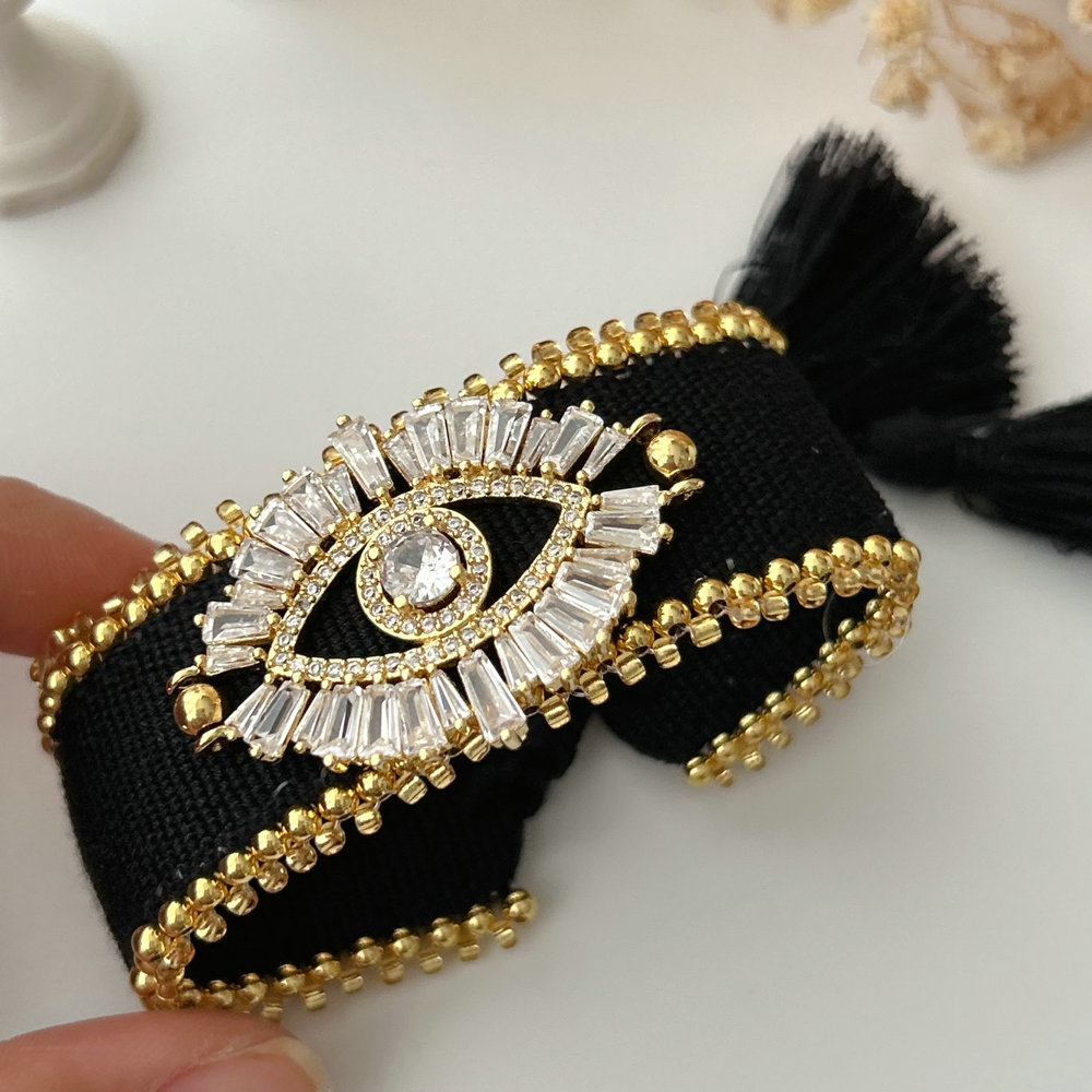 Black cord bracelet with eye charm