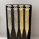 Channel tassel earrings