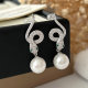 Pave snake pearl earrings