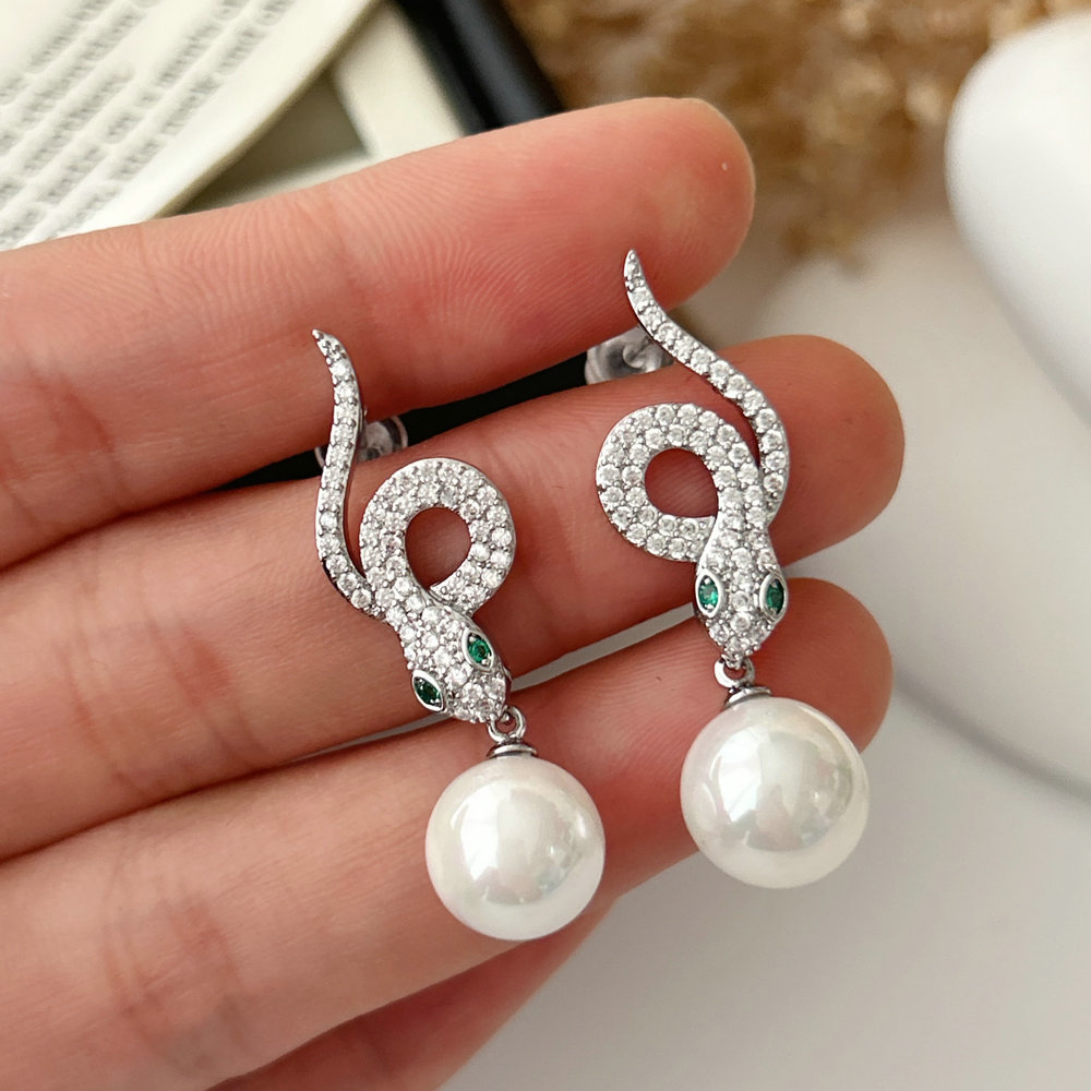 Pave snake pearl earrings