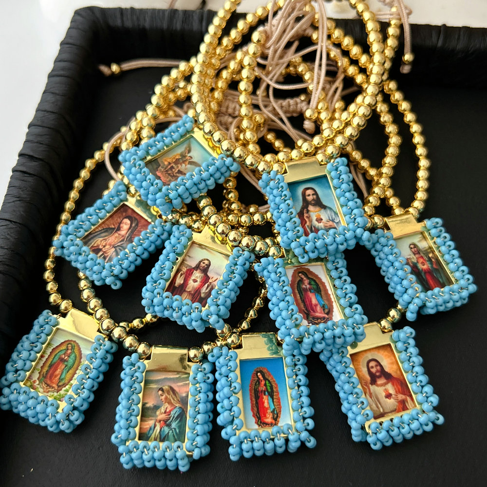 Handmade blue bead religious pendant bracelet
