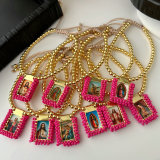 Handmade pink bead religious pendant bracelet