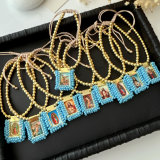 Handmade blue bead religious pendant bracelet